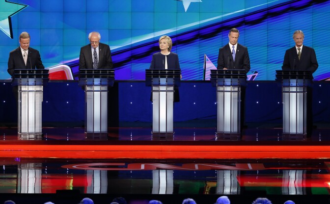 Democratic presidential candidates from left, former Virginia Sen. Jim Webb, Sen. Bernie Sanders, of Vermont, Hillary Rodham Clinton, former Maryland Gov. Martin O'Malley, and former Rhode Island Gov. Lincoln Chafee take the stage before the CNN Democratic presidential debate Tuesday, Oct. 13, 2015, in Las Vegas. (AP Photo/John Locher)
