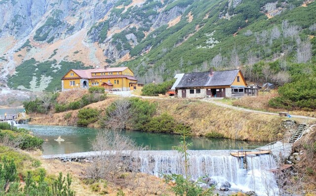 Small houses nestled in a hillside along a river in Zdiar, Slovakia