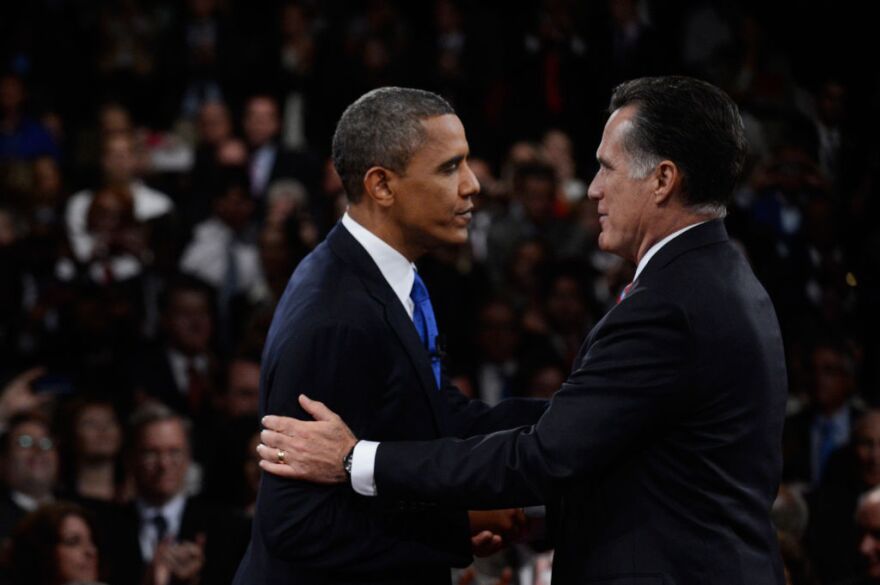 U.S. President Barack Obama (L) shakes hands with Republican presidential candidate Mitt Romney after the debate at the Keith C. and Elaine Johnson Wold Performing Arts Center at Lynn University on October 22, 2012 in Boca Raton, Florida. The focus for the final presidential debate before Election Day on November 6 is foreign policy.