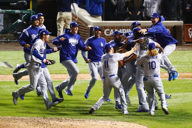 The Los Angeles Dodgers celebrate defeating the Chicago Cubs 11-1 in game five of the National League Championship Series at Wrigley Field on October 19, 2017 in Chicago, Illinois. The Dodgers advance to the World Series.