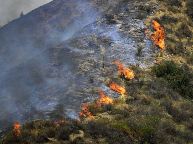 The Brand Fire burns down a hillside near Glendale Sunday afternoon. 

The Brand Fire burns near Glendale and Burbank on Sunday, June 22nd, 2014. No evacuations were in place and the blaze had burned an estimated 75 acres by 6 p.m.