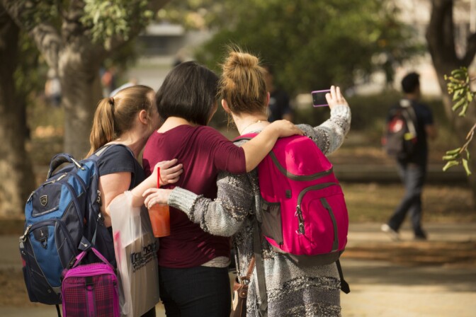 Students taking time to pose for a selfie. 