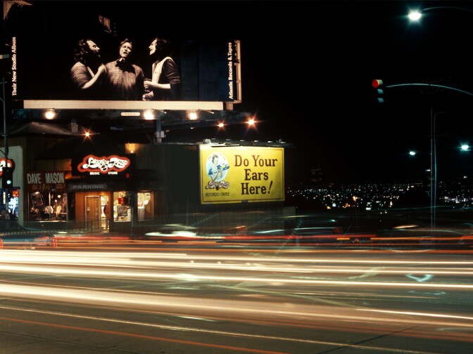Crosby Stills and Nash billboard on the Sunset Strip in Los Angeles, California circa 1977
