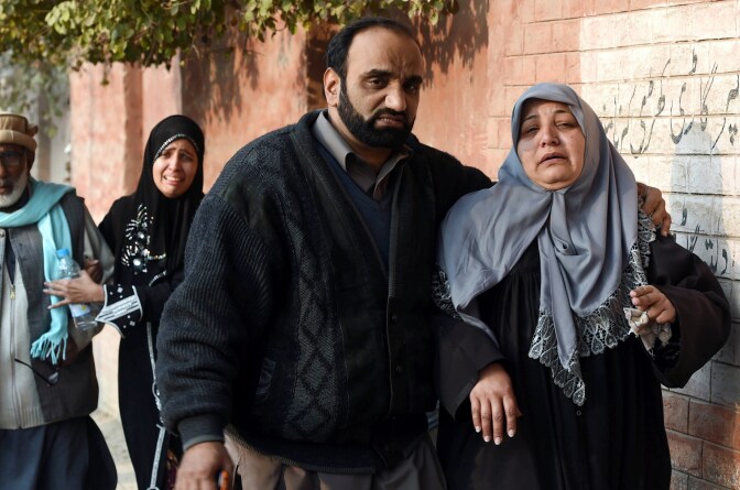 Pakistani parents react near the site of an attack by Taliban gunmen on a school in Peshawar on December 16, 2014. At least 130 people were killed in a Taliban attack on an army-run school in northwest Pakistan, officials said. AFP PHOTO/ A MAJEED        (Photo credit should read A Majeed/AFP/Getty Images)