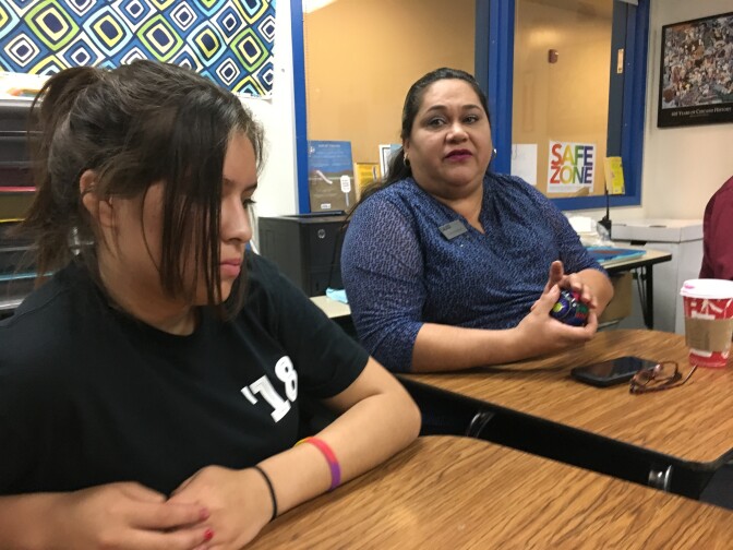 Eighth grader Ana Garcia (left) listens to Santa Ana Unified School Board Member Valerie Amezcua and other district administrators who visited her school to listen to student concerns about Donald Trump's election.