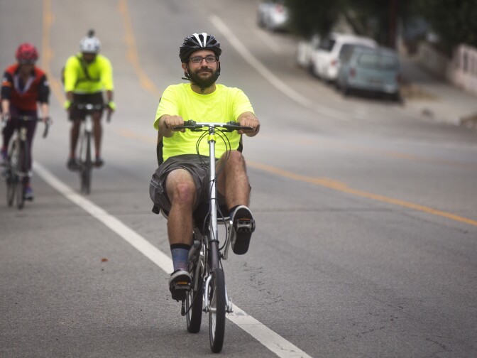 Charles Dandino bikes on San Pascual Avenue in Highland Park on Thursday morning, July 9, 2015 during a bike train commute to Jet Propulsion Laboratory.