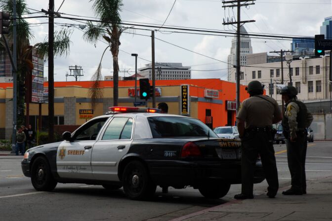 Officers from the Los Angeles County Sheriff's Department guard an intersection outside the Twin Towers Correctional Facility in downtown L.A. on Feb. 8, 2013, following reports that murder suspect Christopher Dorner was seen in the area. The correctional facility and adjoining L.A. County Men's Central Jail were on high alert after the report, resulting in area traffic checkpoints conducted by officers in ballistic vests and helmets.