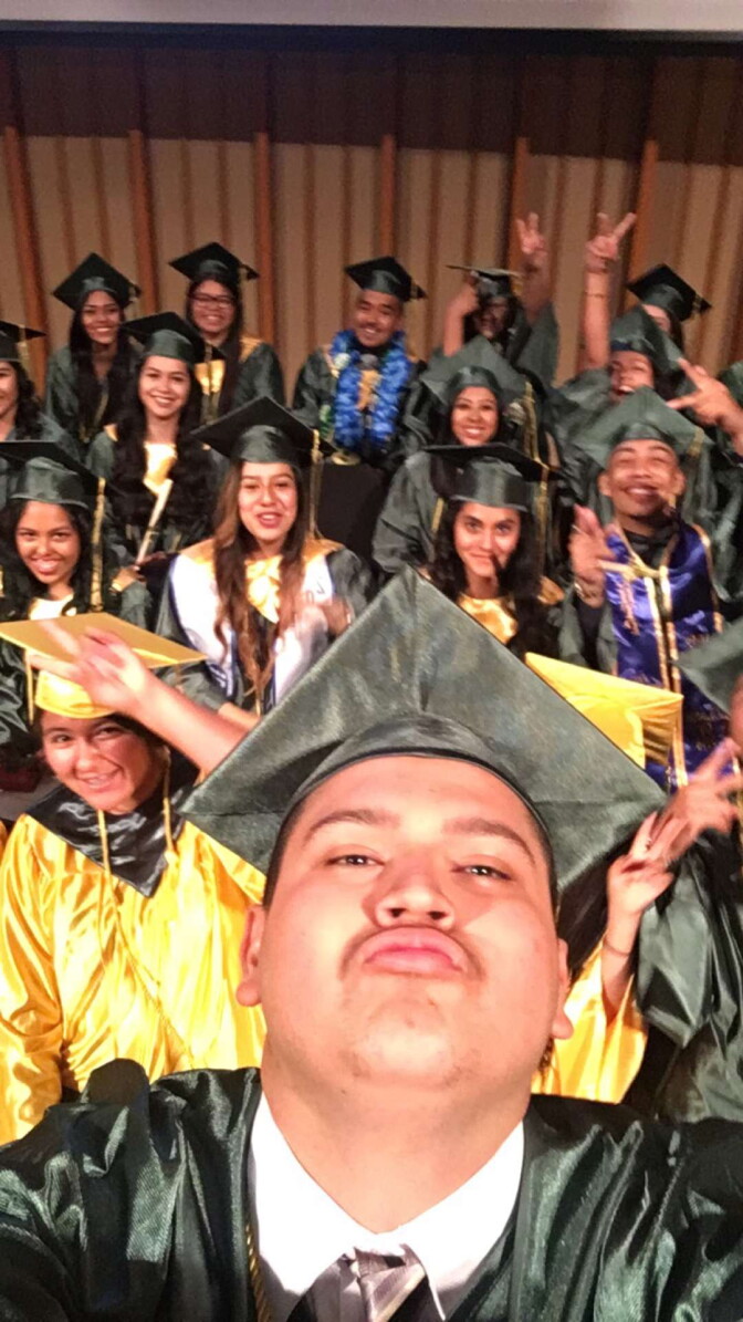 Jeison Reyes pauses for a selfie with his L.A. Leadership Academy high school graduating class of 2016 just before they graduate.