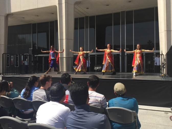 Members of the Blue 13 Dance Company performed at the press conference in the plaza.