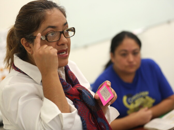 Volunteer Maribel Solache teaches a class for students who are interested in taking the AB 60 driver's license exam at the San Diego County Library Vista Branch.