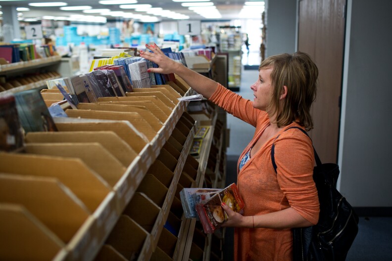 Customer Jenny Mueller, a shopper for television set decorations for "Scandal," shops for items to be used in a Church set. Mueller, who is religious but not part of a denomination, likes Pope Francis because she believes he's rekindling the spirit of what it is to be religious.