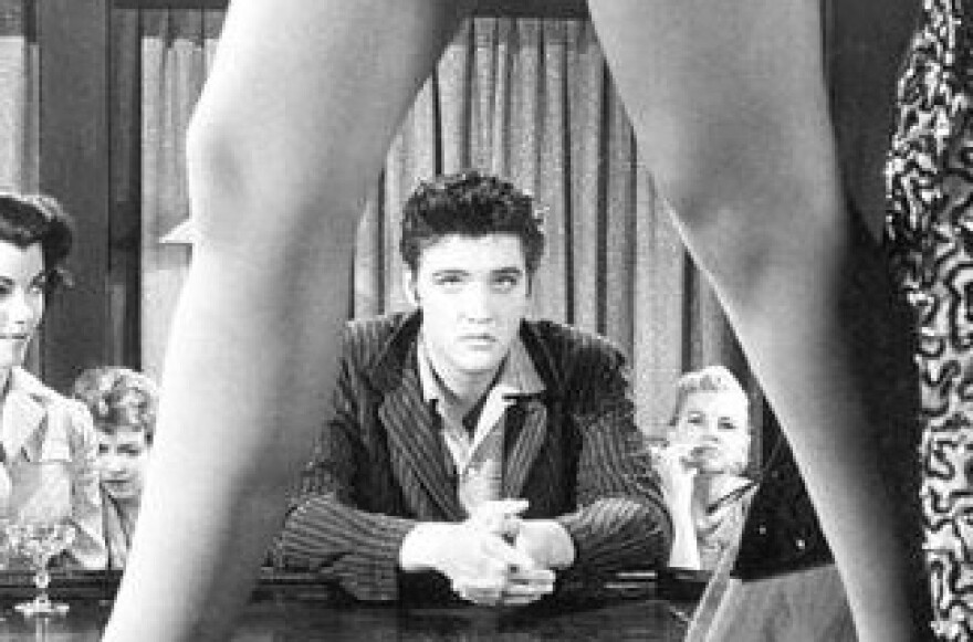 Whose legs these are, I think I know. 
Her home is in the Valley, though. 
(Gloria Pall had great gams and was voted best cleavage by soldiers, and she shocked all decent minded busybodies in the 1950s with her movie show, as Voluptua.
