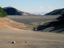 File: View of the nearly-empty Uvas Reservoir and the face of the dam on Feb. 1, 2014.