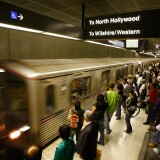 An environmental group that blocked a $237 million commuter rail project in Southern California has agreed to drop its lawsuit. The group opposed a plan to build a Riverside-to-Perris extension of the Metrolink regional train system. (File photo: Passengers board Metro subway trains during rush hour on June 3, 2008 in Los Angeles.)