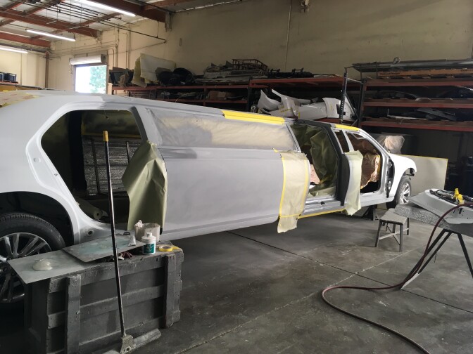 A stretch limo getting prepped for a custom paint job. 