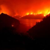 NAPA, CALIFORNIA - AUGUST 19: The LNU Lightning Complex fire burns in the hills surrounding Lake Berryessa on August 19, 2020 in Napa, California. The LNU Lightning Complex fire is spread over 5 counties and has burned over 124,000 acres. The out-of-control wildfire has destroyed at least 50 homes and is zero percent contained. (Photo by Justin Sullivan/Getty Images)