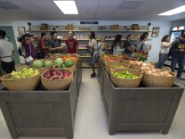 UC Irvine students tour the new, 2,318-square-foot FRESH Basic Needs Hub in September, 2017, stocked with dried and canned goods, fresh fruits and vegetables, refrigerated items and emergency toiletries.