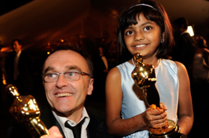 Director Danny Boyle and actress Rubina Ali (holding two of the Academy Award statues that 'Slumdog Millionaire' won) at the 81st Annual Academy Award.