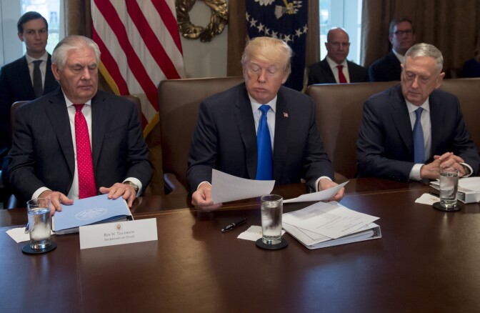 US President Donald Trump holds a Cabinet Meeting alongside Secretary of State Rex Tillerson (L) and Secretary of Defense Jim Mattis (R) in the Cabinet Room at the White House in Washington, DC, December 20, 2017.
US President Donald Trump on Wednesday hailed the imminent adoption of a sweeping Republican tax cut plan as a "victory" for the country.
 / AFP PHOTO / SAUL LOEB        (Photo credit should read SAUL LOEB/AFP/Getty Images)