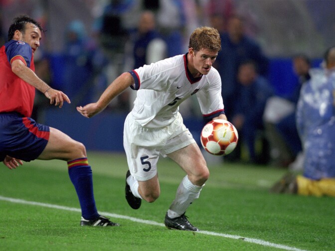 John O'Brien of the United States dribbles past Lacruz of Spain during the Olympic Men's Soccer competition at Sydney Stadium in Sydney, Australia on September 26, 2000. 