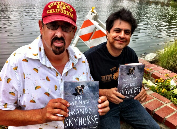 Brando Skyhorse, right, with Frank, one of his five fathers. They're posing at the Echo Park boathouse, in the neighborhood Skyhorse describes in his memoir, "Take This Man."