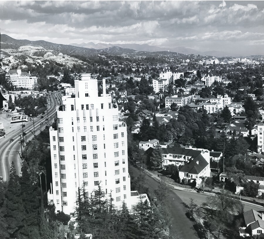 In 1949, Sunset Tower overlooks the Sunset Strip as Sunset Boulevard winds eastward past the Chateau Marmont toward Hollywood, with the Hollywood hills and San Gabriel range in the background.