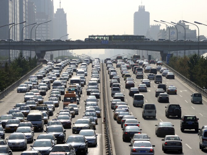 Vehicles drive on the road through the central business district in Beijing on August 4, 2010. A traffic jam on the Beijing-Tibet Expressway, stretching more than 62 miles, has lasted more than nine days.