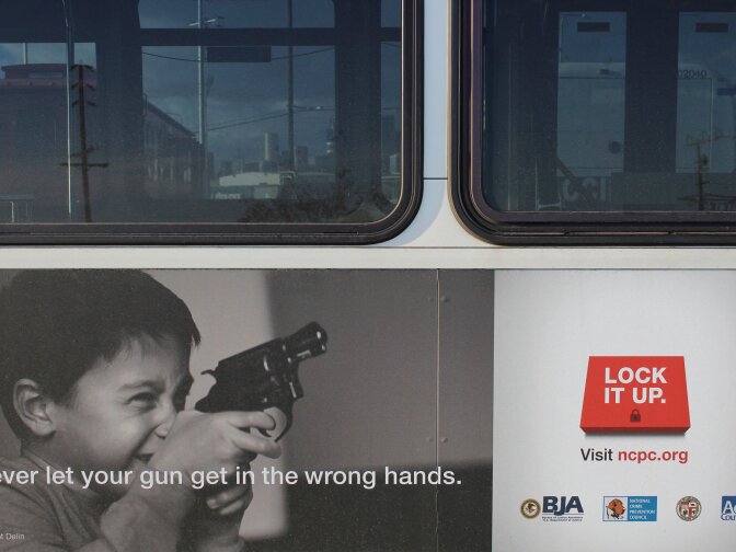 A bus with the Lock It Up gun safety campaign on its side.