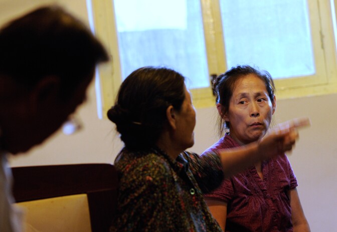 This picture taken on September 4, 2012 shows Wu Rui talking with her mother during an interview at her home in Beijing. When Wu Rui's 12-year-old daughter died she lost not just the only child she would ever have but also her source of security and support in old age.