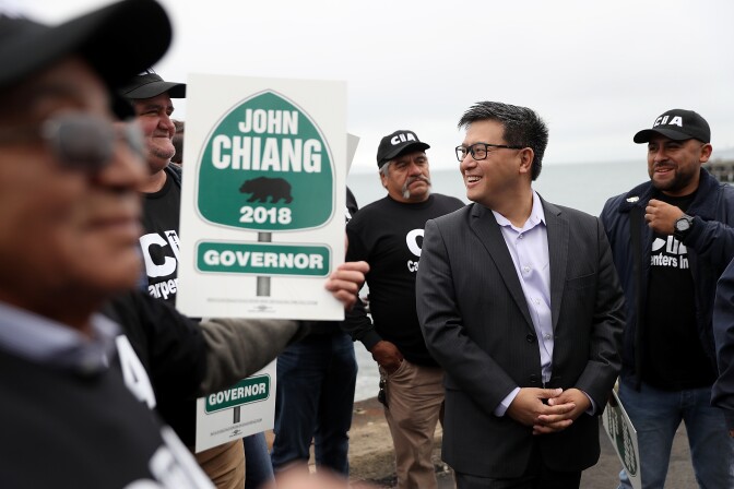  California Democratic gubernatorial candidate, California State Treasurer John Chiang, greets union carpenters during a campaign event near the Golden Gate Bridge on June 7, 2017 in San Francisco, California.