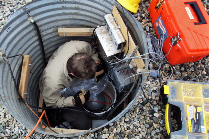 Russell Oliver removes the plastic from a brand new STS 2.5, a top of the line motion sensor. This sensor is part of a pilot system that could provide Californians with up to a minute of warning before an earthquake reaches them.