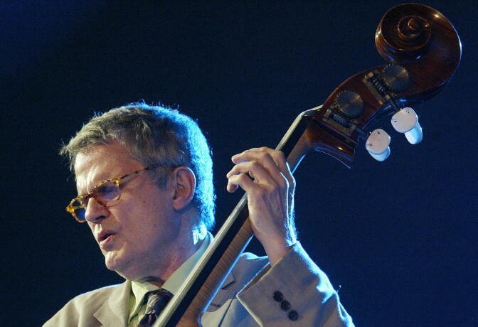 In this file photo, U.S. Iowa-born jazz musician Charlie Haden performs late 14 July 2005 at the Vitoria-Gasteiz Jazz Festival in the Spanish northern Basque city of Vitoria. Haden's label, ECM, reported Friday that he had died at 77.