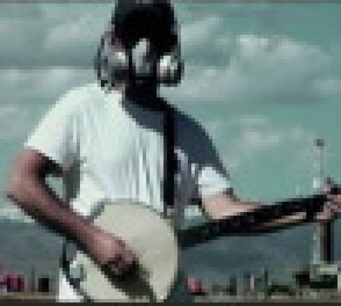 Josh Fox wears gas mask and plays banjo in 'Gasland.'