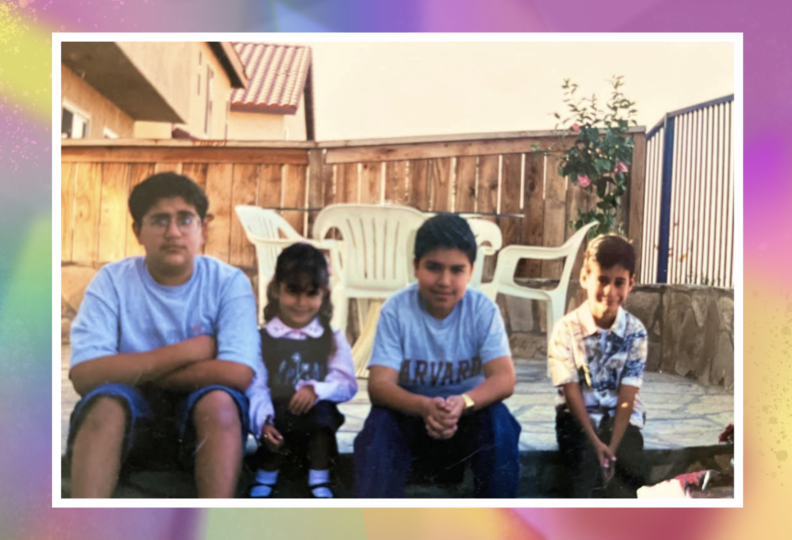 A faded color photograph shows four children with dark hair, a girl and three boys, seated on a step in a backyard patio. A white patio table is in the background.