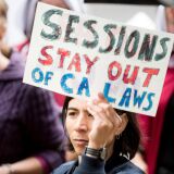 People protest outside a speech by US Attorney General Jeff Sessions March 7, 2018, in Sacramento, California. Sessions admonished California politicians for not cooperating with federal authorities on immigration enforcement issues.
US Attorney General Jeff Sessions warned California Wednesday that the federal government would use all its legal powers to fight protections provided unauthorized immigrants, a day after suing the state over its sanctuary laws."California is using every power it has -- and some it doesn't -- to frustrate federal law enforcement. So you can be sure I'm going to use every power I have to stop them," Sessions told law enforcement officials in Sacramento.
 / AFP PHOTO / NOAH BERGER        (Photo credit should read NOAH BERGER/AFP/Getty Images)