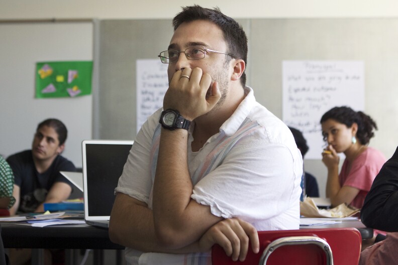 Diego Robles looks on during a lesson at Cortines high school. Robles is one of 12 students participating in a new teaching artist training program through CalArts.