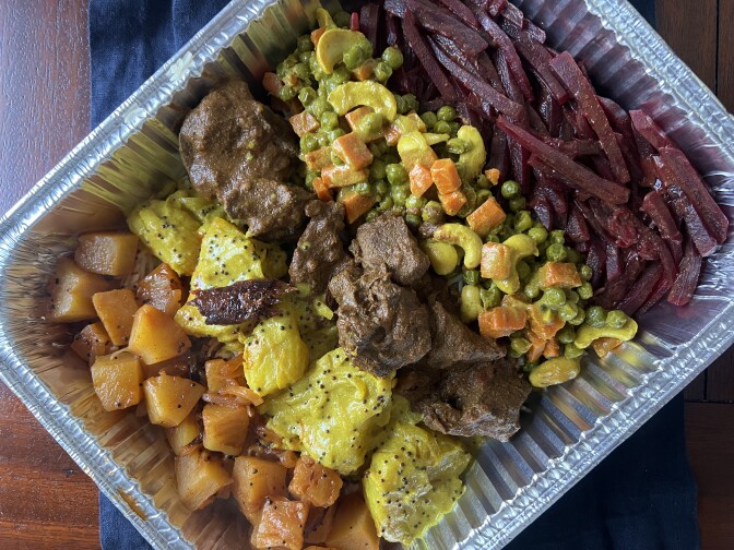 Colorful foods in an aluminum tray. 