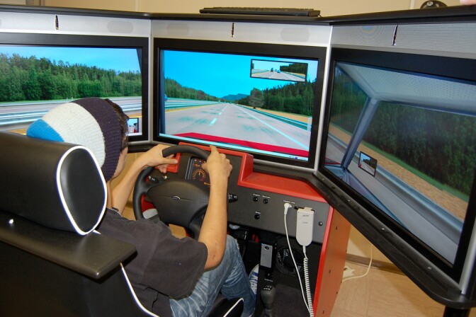 A teenager in a driving simulator during a driver's education class.