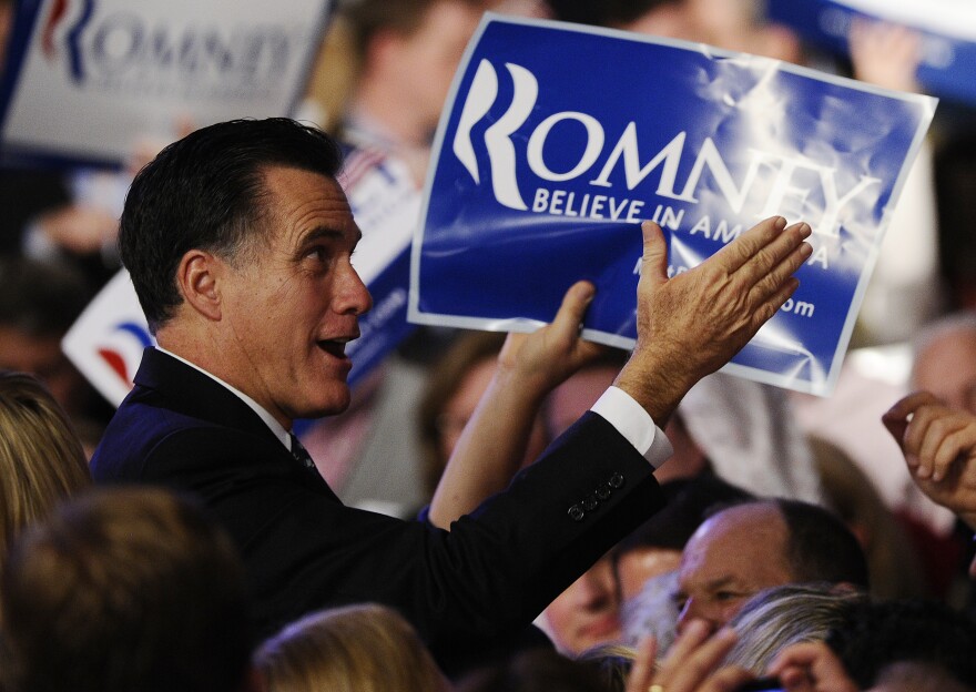 Republican presidential hopeful Mitt Romney greets supporters after addressing a primary night victory rally in Manchester, New Hampshire, January 10, 2012.  