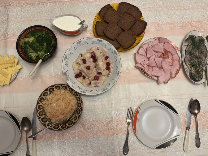 Homemade sauerkraut and cherry varenyky dumplings are served for dinner at Lusia Kuznetsova's Soviet-era apartment in Kyiv, Ukraine.