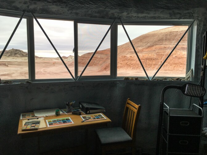A window in the station's science lab looks out onto Utah's Mars-like desert landscape.