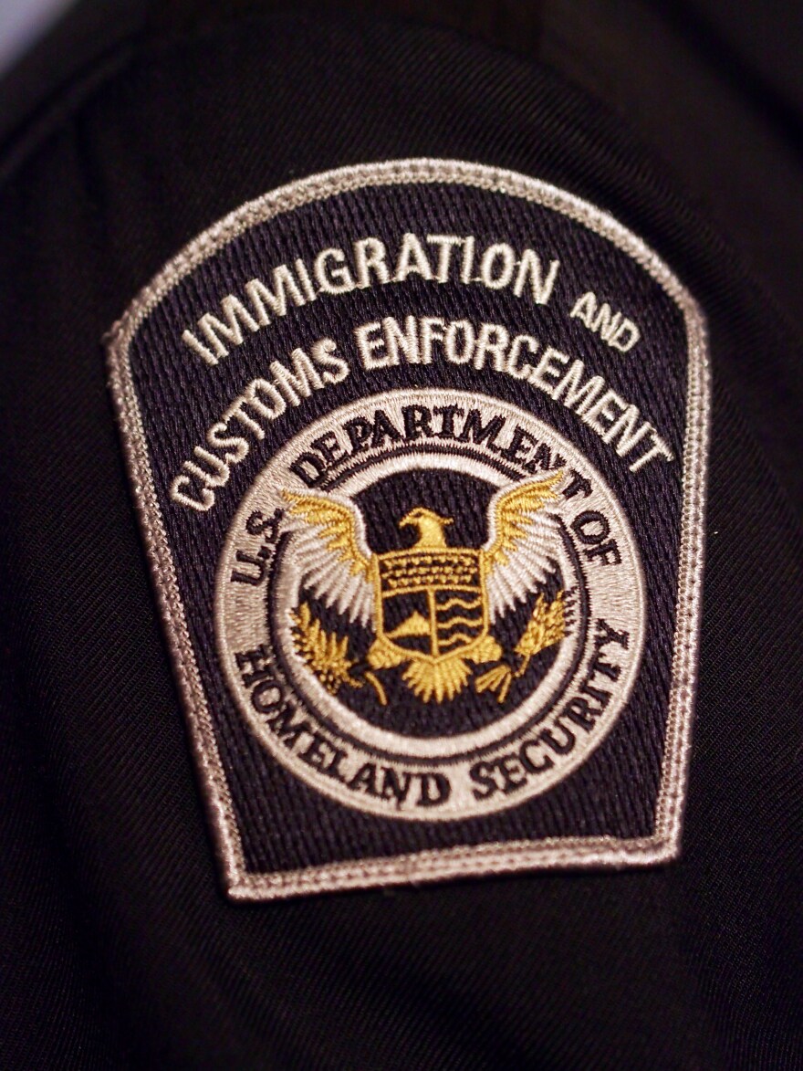 File: An Immigration and Customs Enforcement (ICE) badge on a uniform is viewed on March 5, 2014 at the preview of a temporary exhibition at the National Museum of Crime and Punishment spotlighting ICE's work and accomplishments in Washington, D.C.

