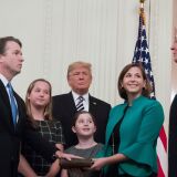 Brett Kavanaugh (L) is sworn-in as Associate Justice of the US Supreme Court by retired Associate Justice Anthony Kennedy (R) before wife Ashley Estes Kavanaugh (2nd-R), daughters Margaret (2nd-L) and Elizabeth (C), and US President Donald Trump on October 8, 2018, at the White House in Washington, DC. (Photo by Jim WATSON / AFP)        (Photo credit should read JIM WATSON/AFP/Getty Images)
