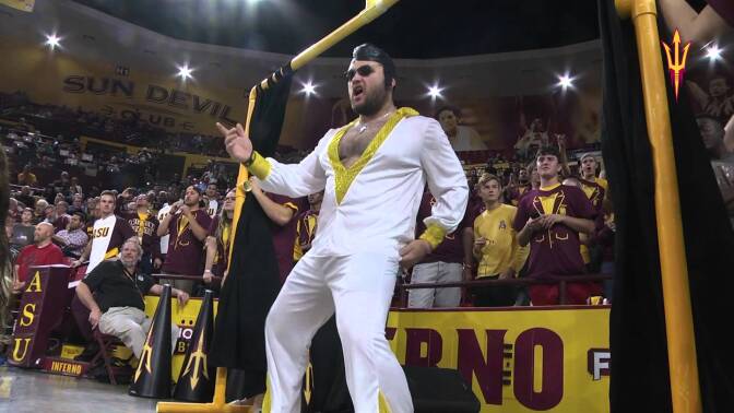 An Arizona State student dressed up as Elvis Presley. He participates in the school's Curtain of Distraction.