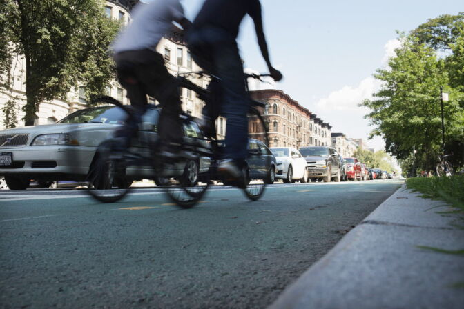 NEW YORK, NY - AUGUST 17: People ride along a controversial bike lane on Prospect Park West on August 17, 2011 in the Brooklyn borough of New York City. In what is being viewed as a victory for the Bloomberg administration, a judge on Tuesday dismissed an effort by Brooklyn residents to remove a bicycle lane installed by the city on Prospect Park West. Mayor Michael Bloomberg, along with his transportation commissioner, Janette Sadik-Khan, has attempted to make New York more bicycle and pedestrian friendly with numerous bike and pedestrian lanes around New York City. The effort has angered some in the city who see the lanes as adding to traffic, taking up parking spaces and a danger to pedestrians. (Photo by Spencer Platt/Getty Images)