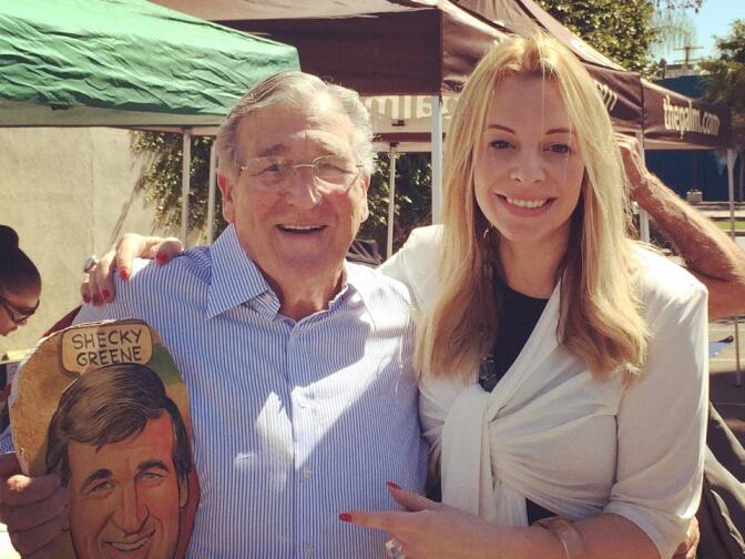 Alison Martino helped hand out caricatures that once lined the walls of West Hollywood restaurant Palm. When it closed, many of the subjects including Shecky Greene stopped by to save their images.