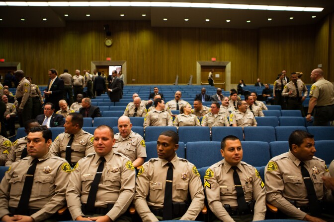 Members of the Los Angeles County sheriff's department wait for Undersheriff Paul Tanaka's hearing to begin with the County Board of Supervisors on July 27, 2012.