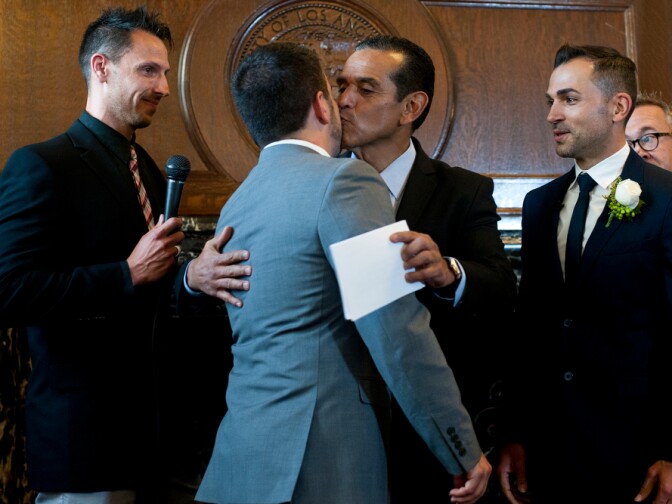 Paul Katami and Jeff Zarrillo, plaintiffs in the Supreme Court case that overturned California's same-sex marriage ban, became the first gay couple to wed in Los Angeles since 2008 on Friday at City Hall. Outgoing Mayor Antonio Villaraigosa officiated the ceremony.