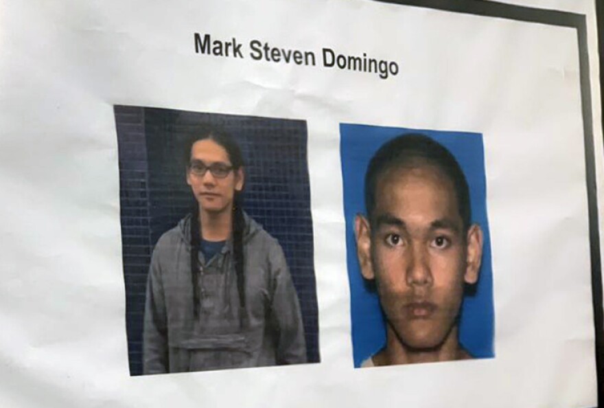 A printed photo of Mark Steven Domingo is shown, including a close-up of his face an an image that shows him from the waist up.