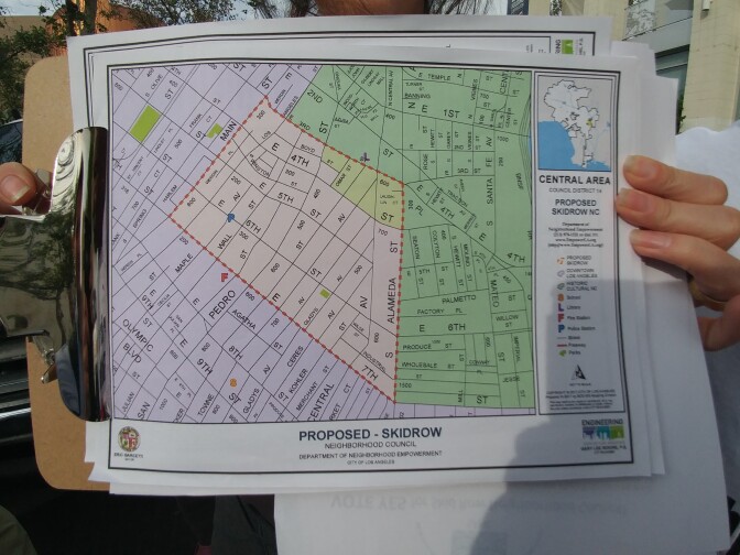 A volunteer holds a map showing the proposed borders for the Skid Row Neighborhood Council on Thursday, April 6, 2017. The effort to establish the council was defeated in a special election, to the disappointment of hundreds of homeless Skid Row residents. 